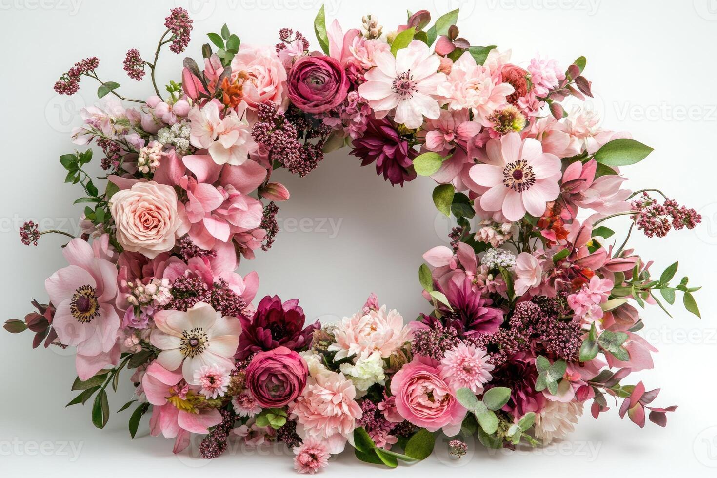Decorative floral wreath showing pink and burgundy flowers on white background photo