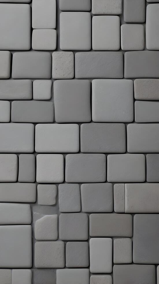 A vertical shot of gray stone tiles arranged in a linear fashion, with plenty of blank space for text overlays. photo