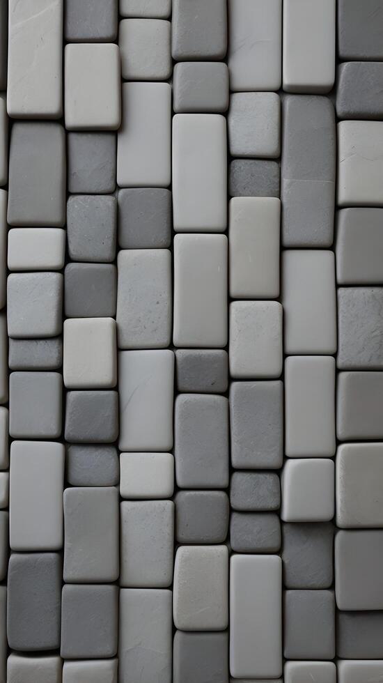 A vertical background of smooth gray stone tiles arranged in a linear pattern, perfect for text overlays with copy space. photo