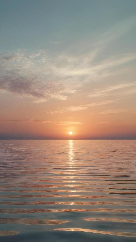 A peaceful vertical view of warm sunset tones mirrored on calm water, with ample room for text placement. photo