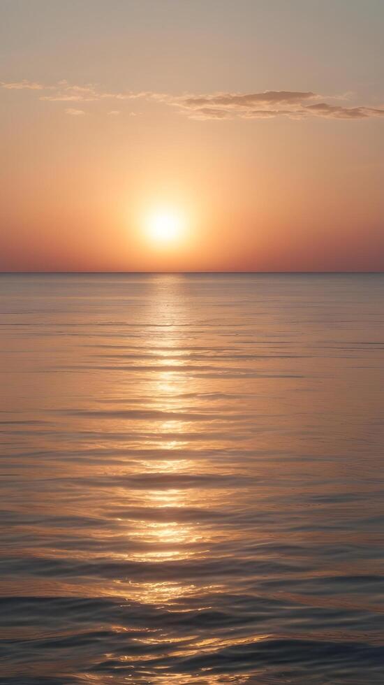 A peaceful vertical image of a pastel sunrise over a calm horizon, with clear space for text or design elements. photo