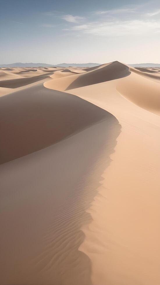 A high-detail vertical view of wind-swept sand dunes with smooth contours and an open sky for copy placement. photo