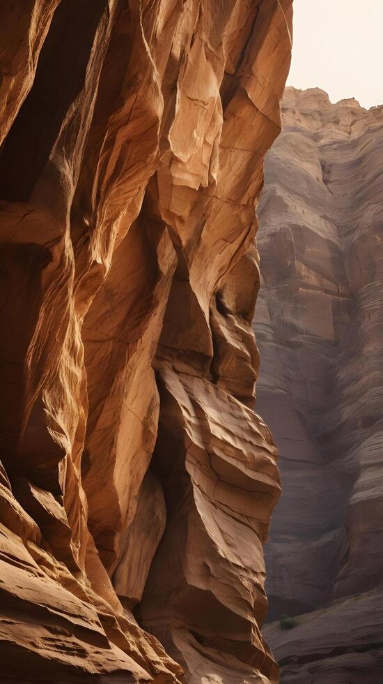A vertical photo capturing the intricate details of a canyon wall with warm rock layers, providing clear space in the sky or textures for copy.