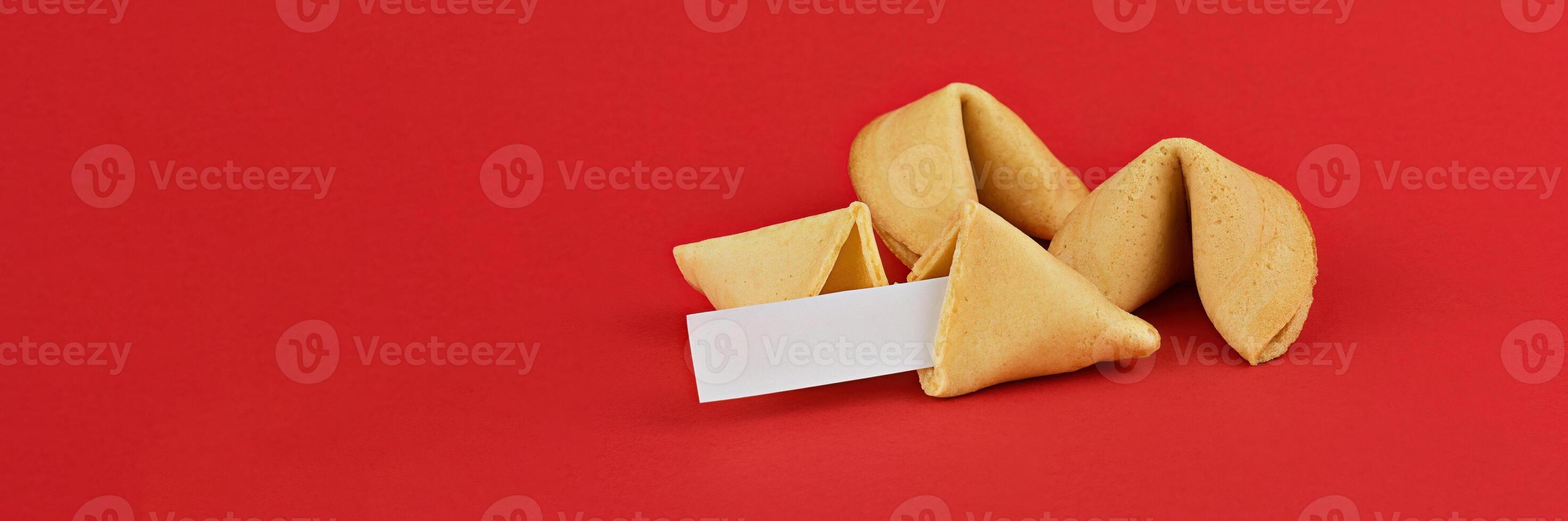 Fortune cookies on red background, featuring blank fortune slip, perfect for customization and personal messages with copy space photo