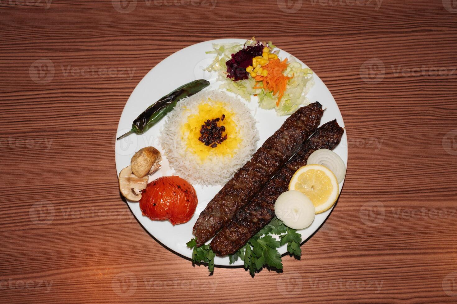Turkish kebab plate with rice and salad. Retro flash food photography photo