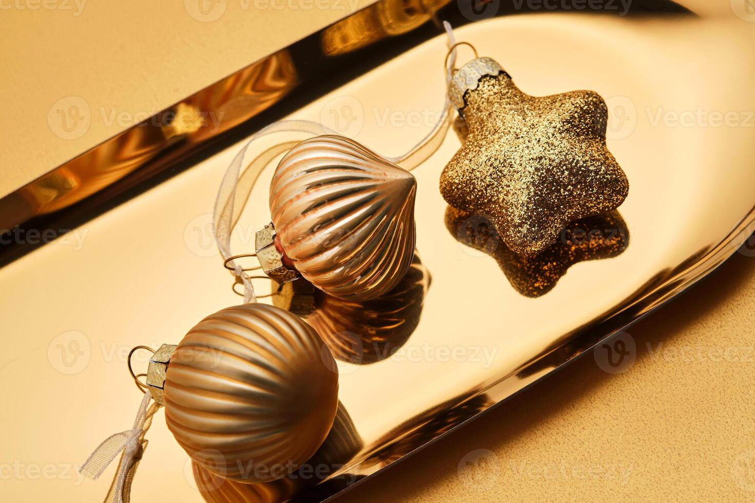 Christmas tree toys on a golden tray. photo