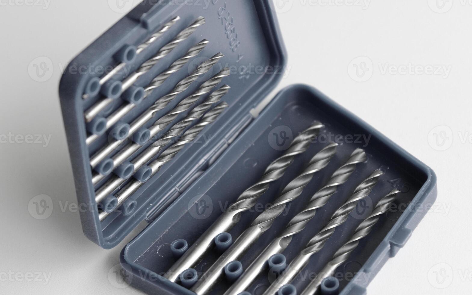 Drills for metal with different diameter arranged by size in special box with open lid photo
