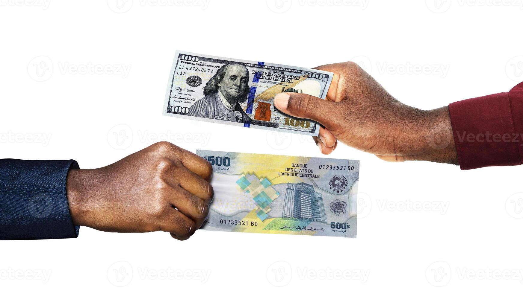 USA Dollar Central African CFA Franc currency pairing.Black African hands holding exchanging comparing two bank notes. USA versus CFA. Weighing Currencies against each other. Exchange rate photo