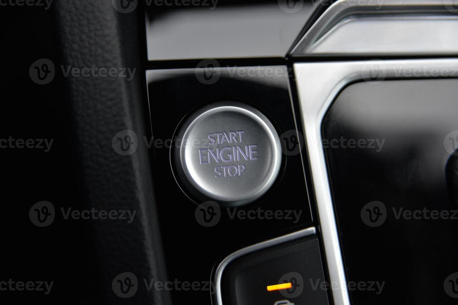 Close up of a car's start engine stop button photo