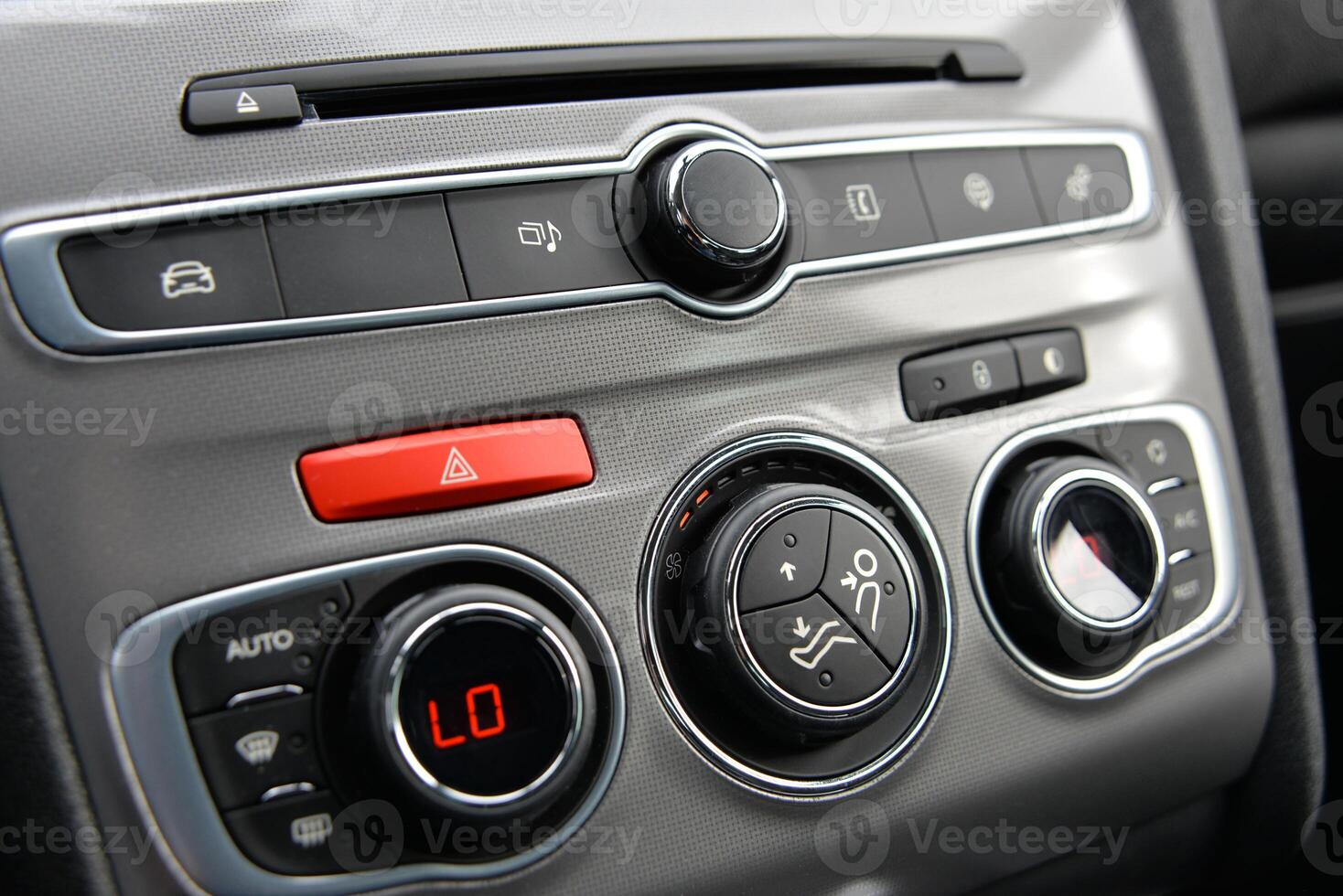 Modern car dashboard with climate and audio controls photo
