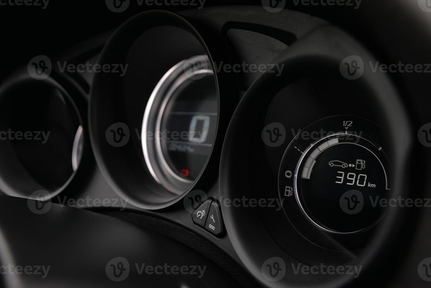 Close up of a car's dashboard displaying fuel level and mileage photo