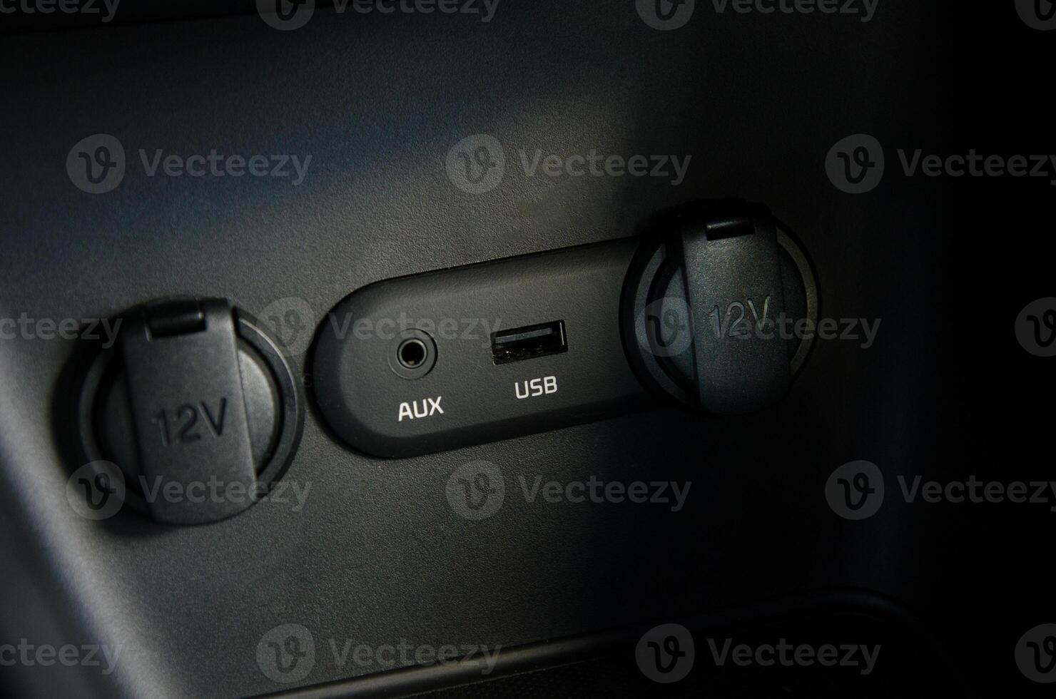 Car interior detail AUX USB and 12V power ports photo