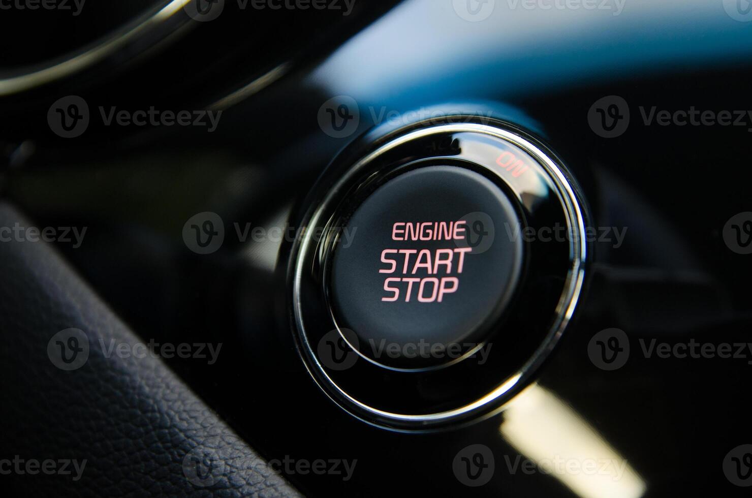 Close up of a car's engine start stop button Sleek modern design photo