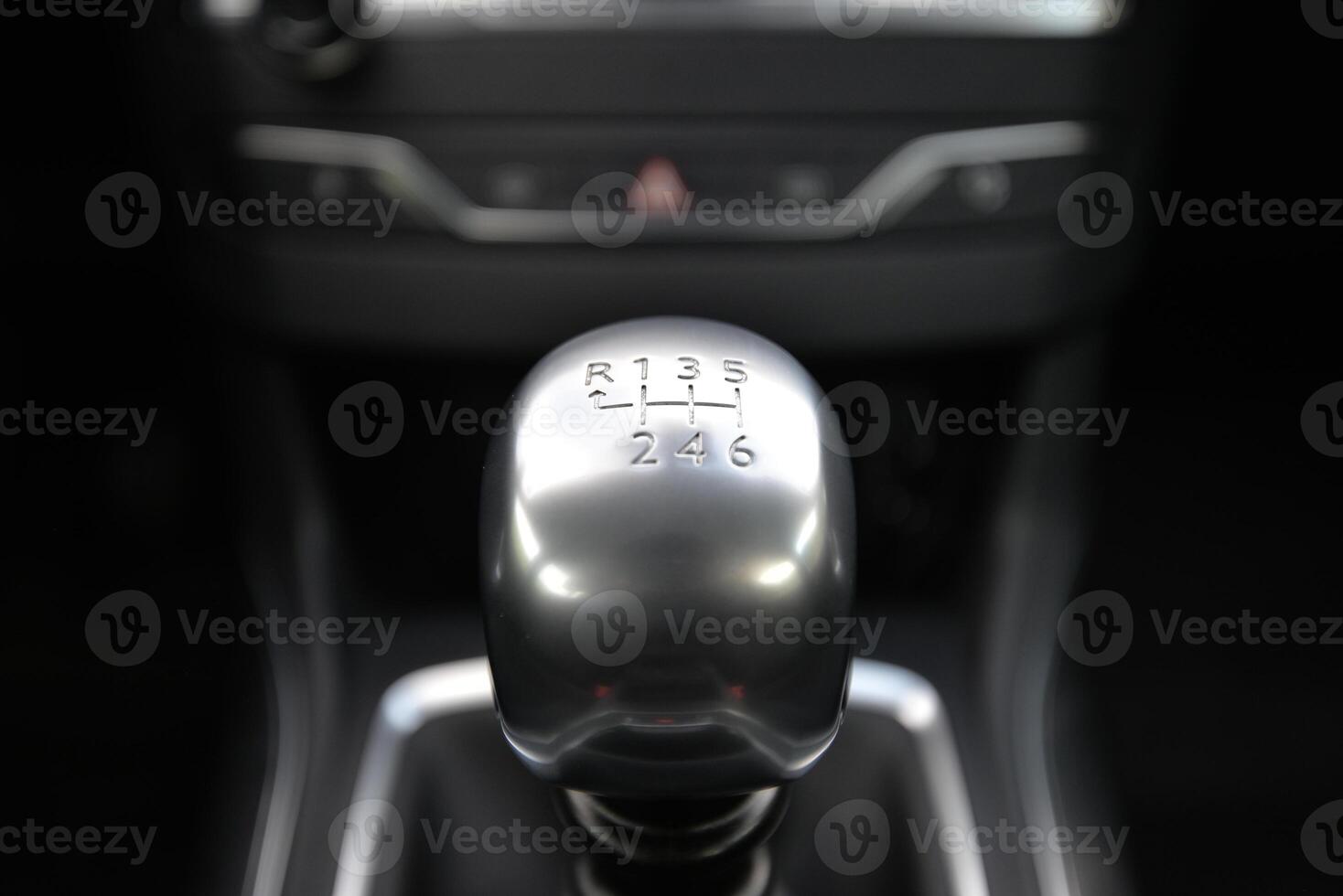 Close up of a silver metallic manual gear stick in a car's interior photo