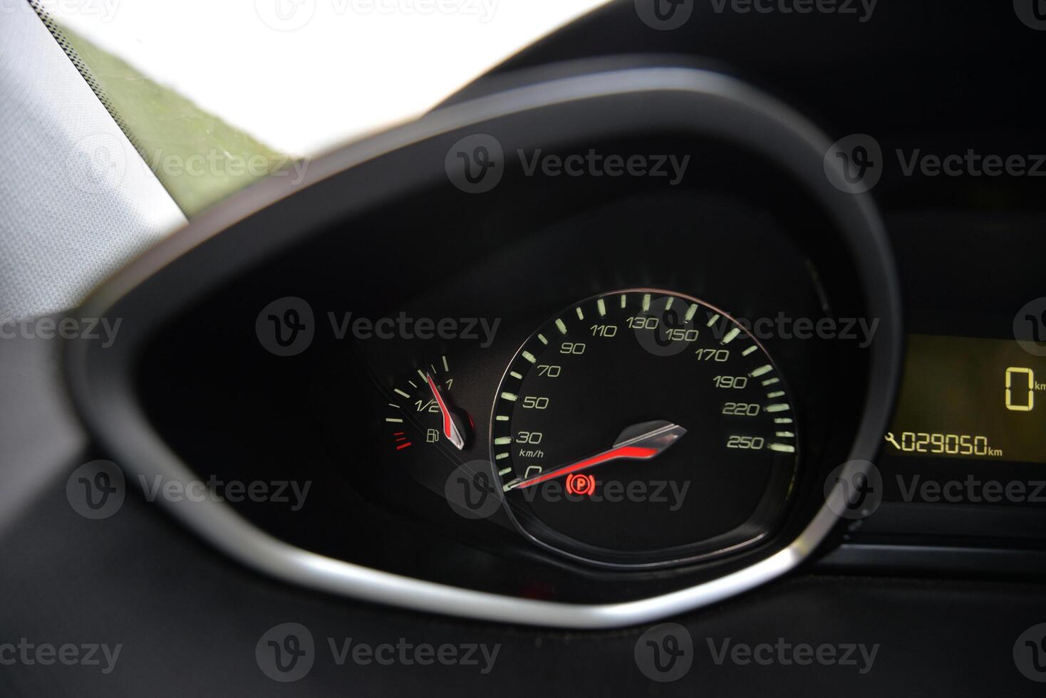 Close up of a car's dashboard with speedometer fuel gauge and odometer photo