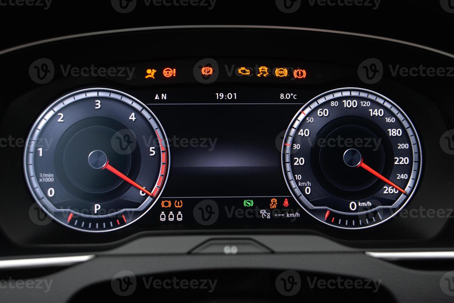 Car dashboard display showing speed RPM and warning lights photo