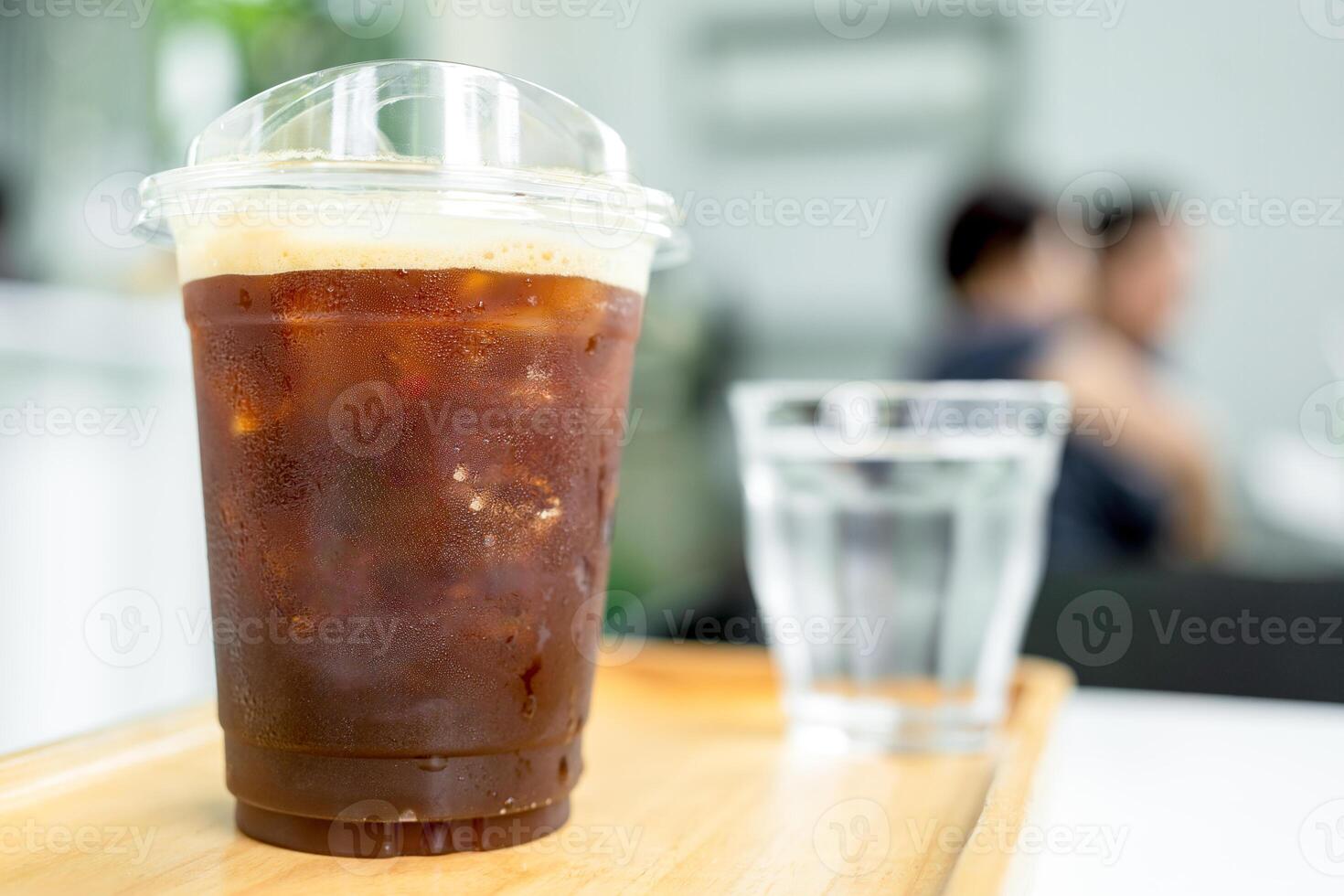 Iced cold brew coffee in the plastic cup with copy space photo