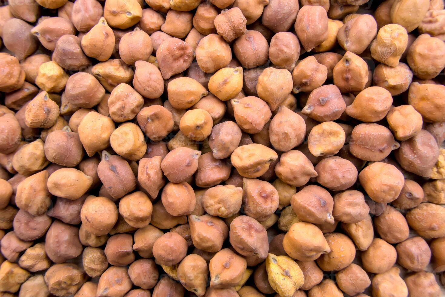 Full-Frame Close-Up of Black or Brown Chickpeas with Textured Details photo