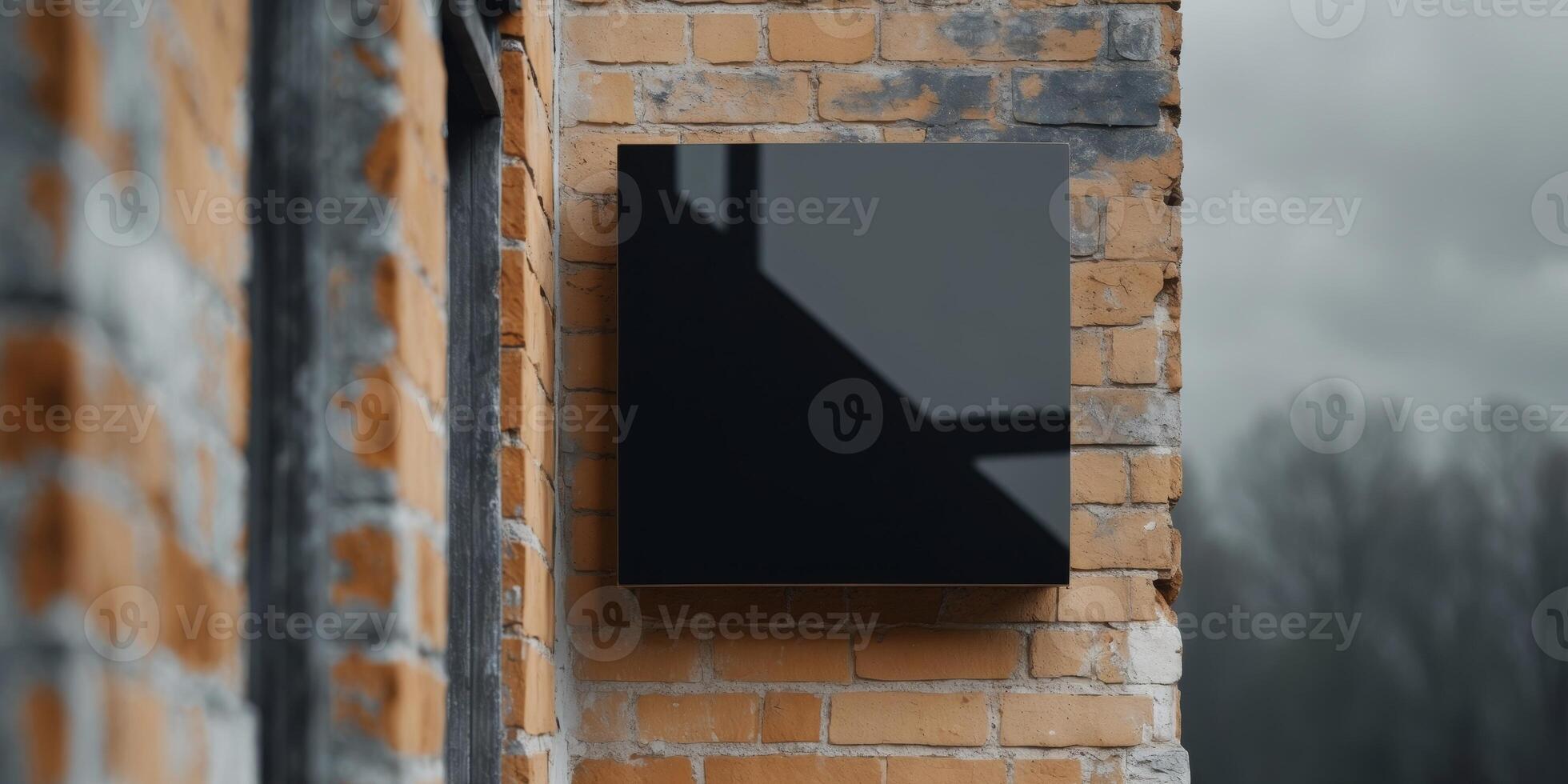 Blank Black Square Sign Mockup on Brick Building photo