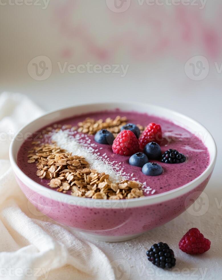 Delicious Berry Smoothie Bowl with Granola and Fresh RaspberriesDelicious Berry Smoothie Bowl with Granola and Fresh Raspberries. photo