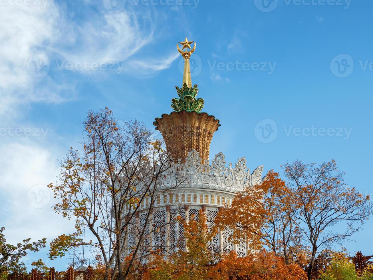 The spire of the pavilion Agriculture in the autumn, VDNH, Moscow. photo