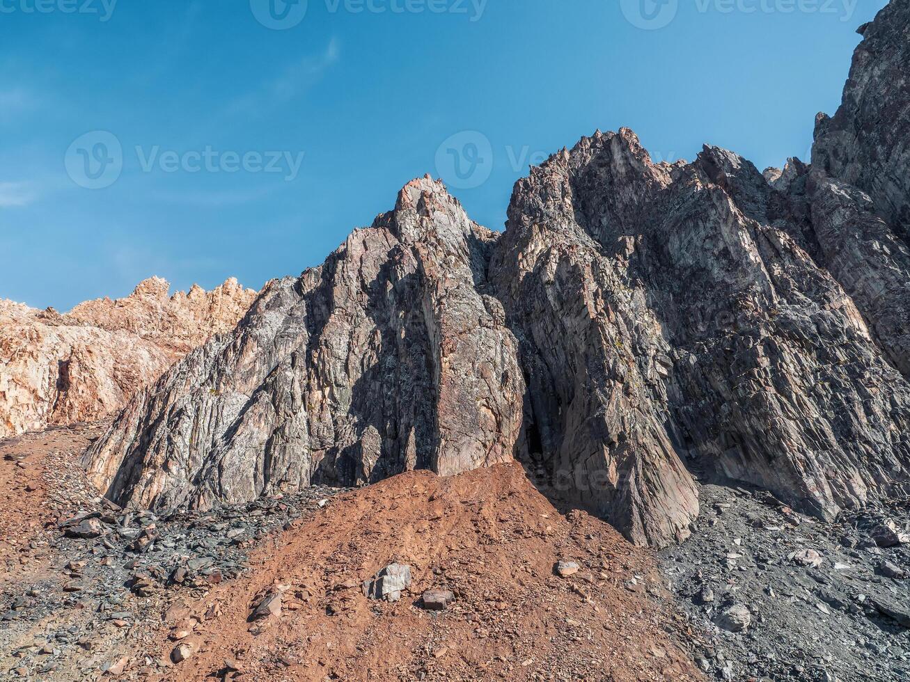 Abstract crumbling cliff rock formation. Eroding rock cliffs. photo