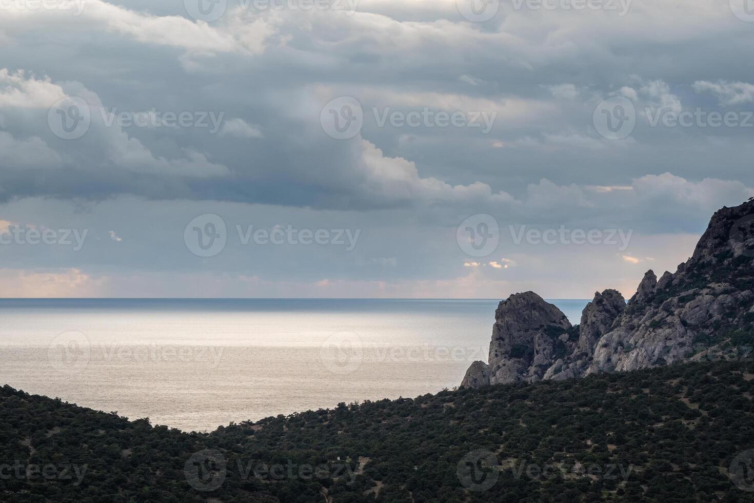 Amazing view of the sparkling sea and the mountain beach photo