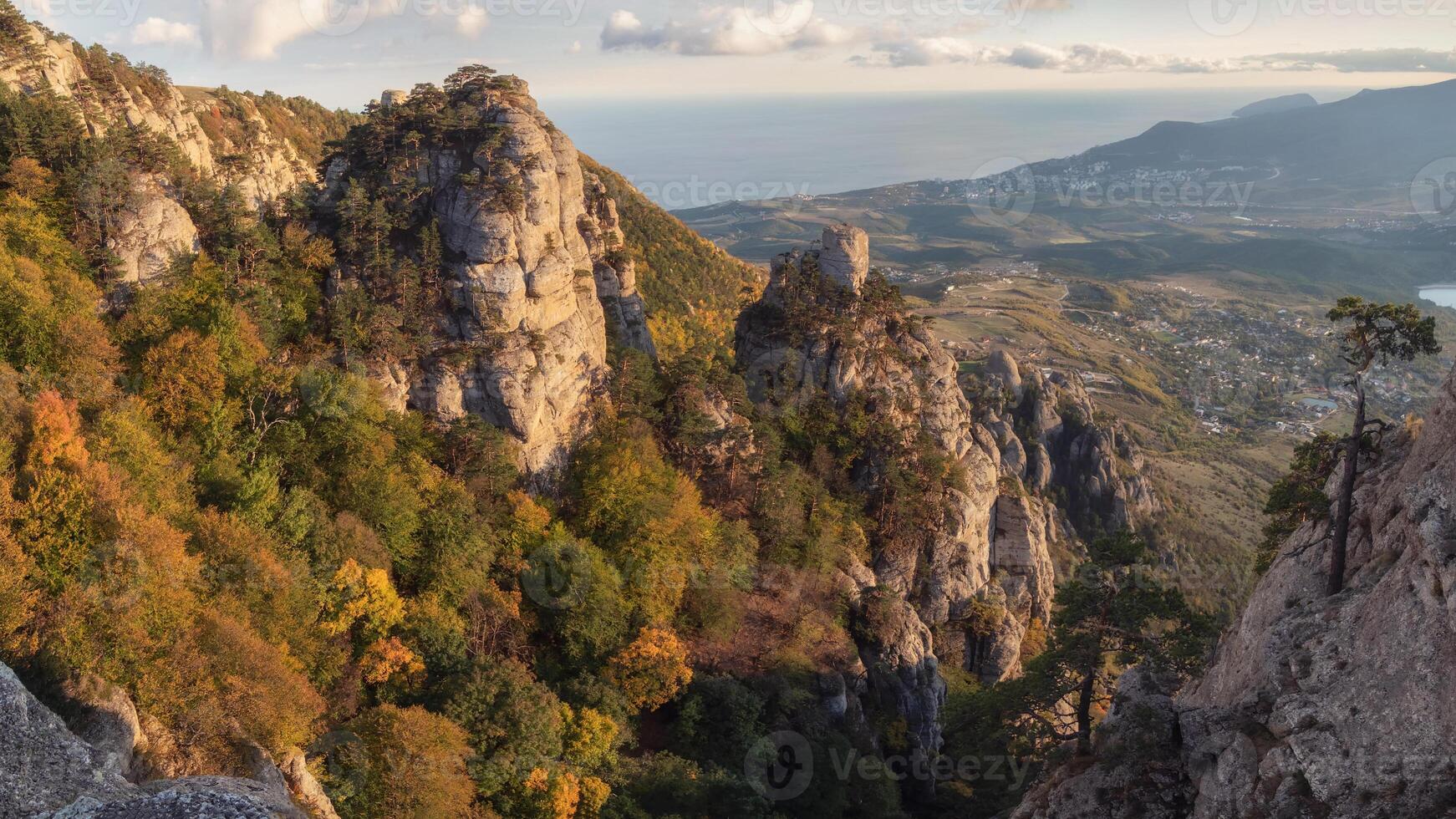 Mountain panoramic landscape with valley, rocks and blue cloudy sky photo