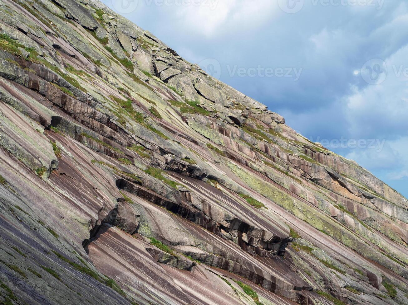 Ancient stone layers, diagonal bottom of the world ocean, faults, rocks. photo