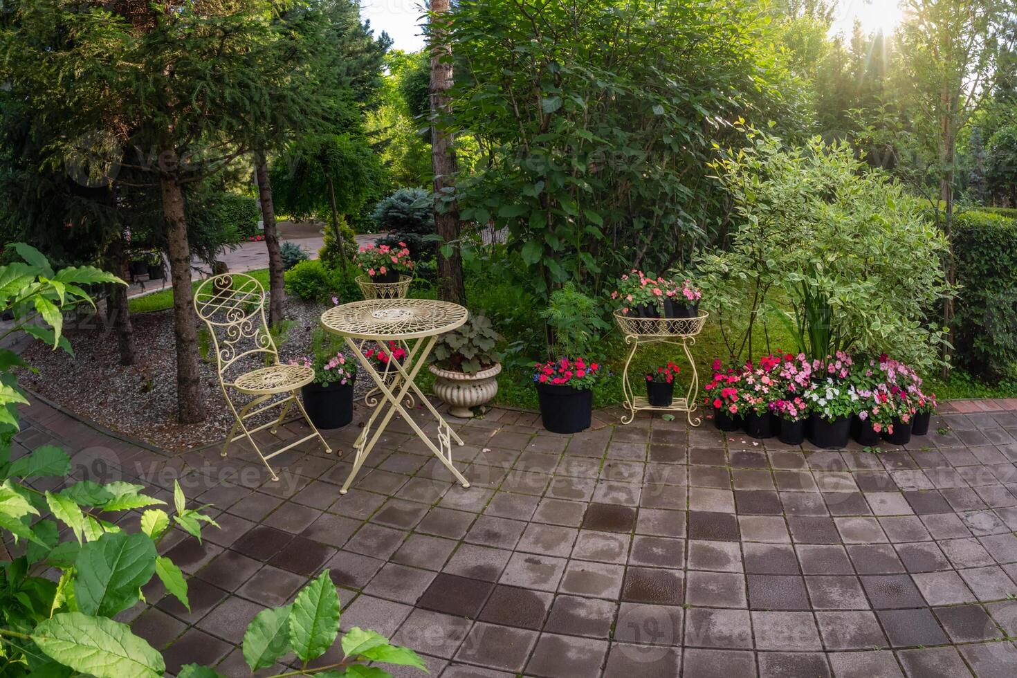 round wrought-iron table and chair of the garden photo