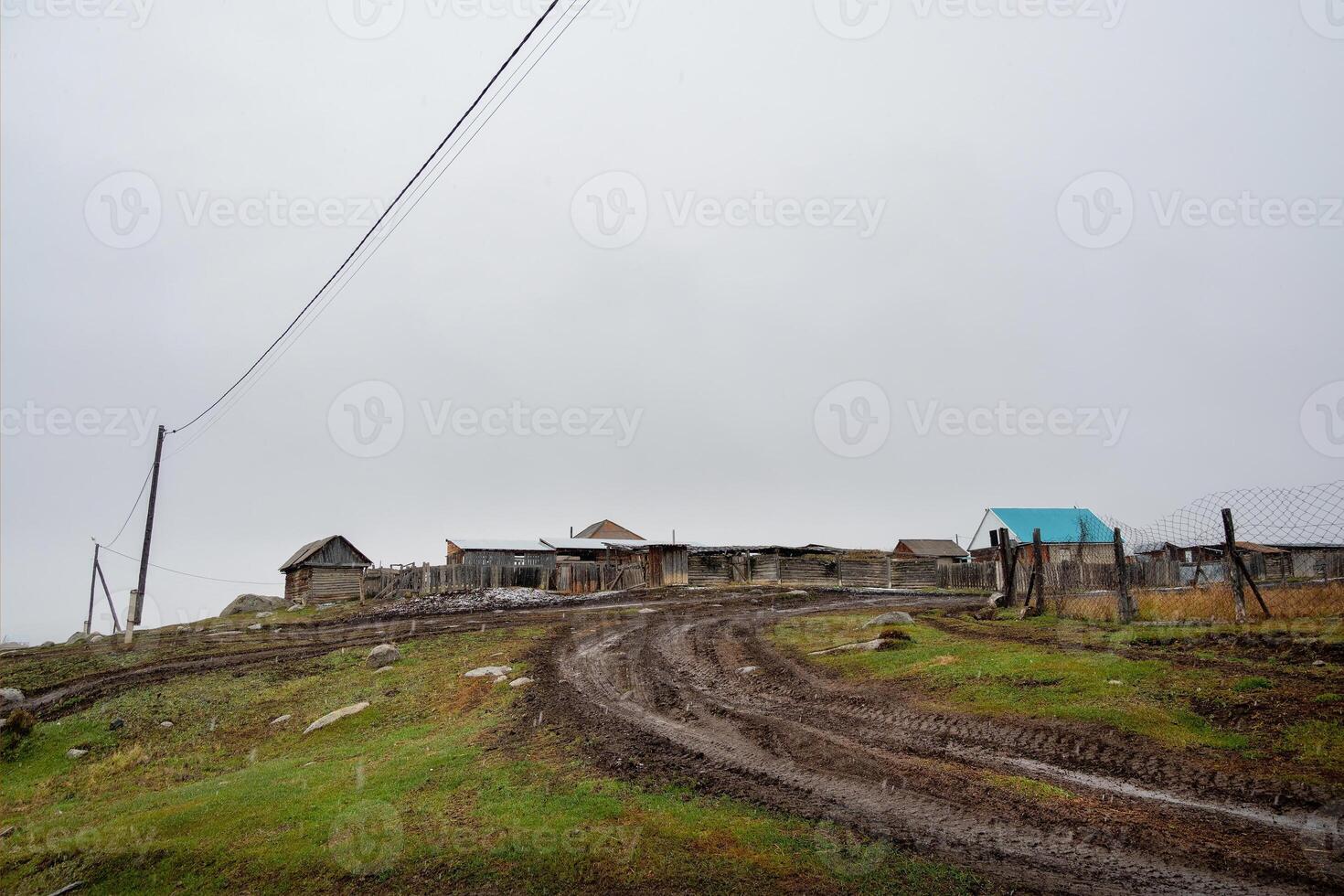 Gloomy autumn landscape of foggy morning in the village of Belyashi, Russia photo