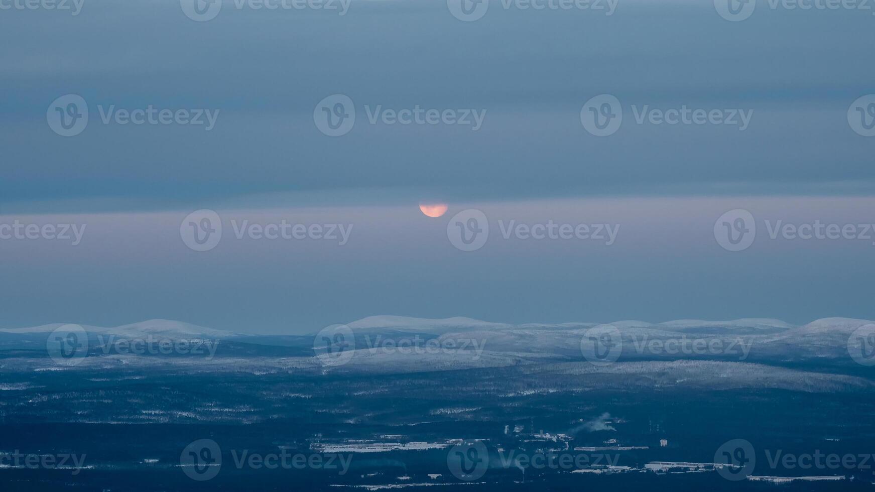 Moon partly hidden behind clouds. Part of the full moon photo