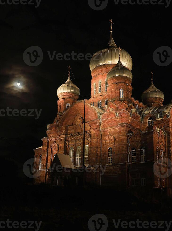 Ancient orthodox church built with red bricks on the night photo