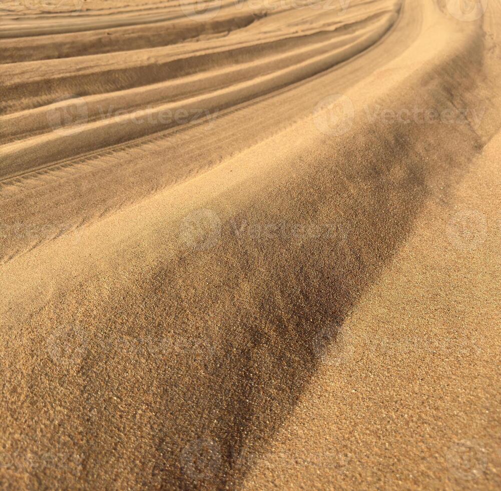 Geometric shapes in the sand. photo