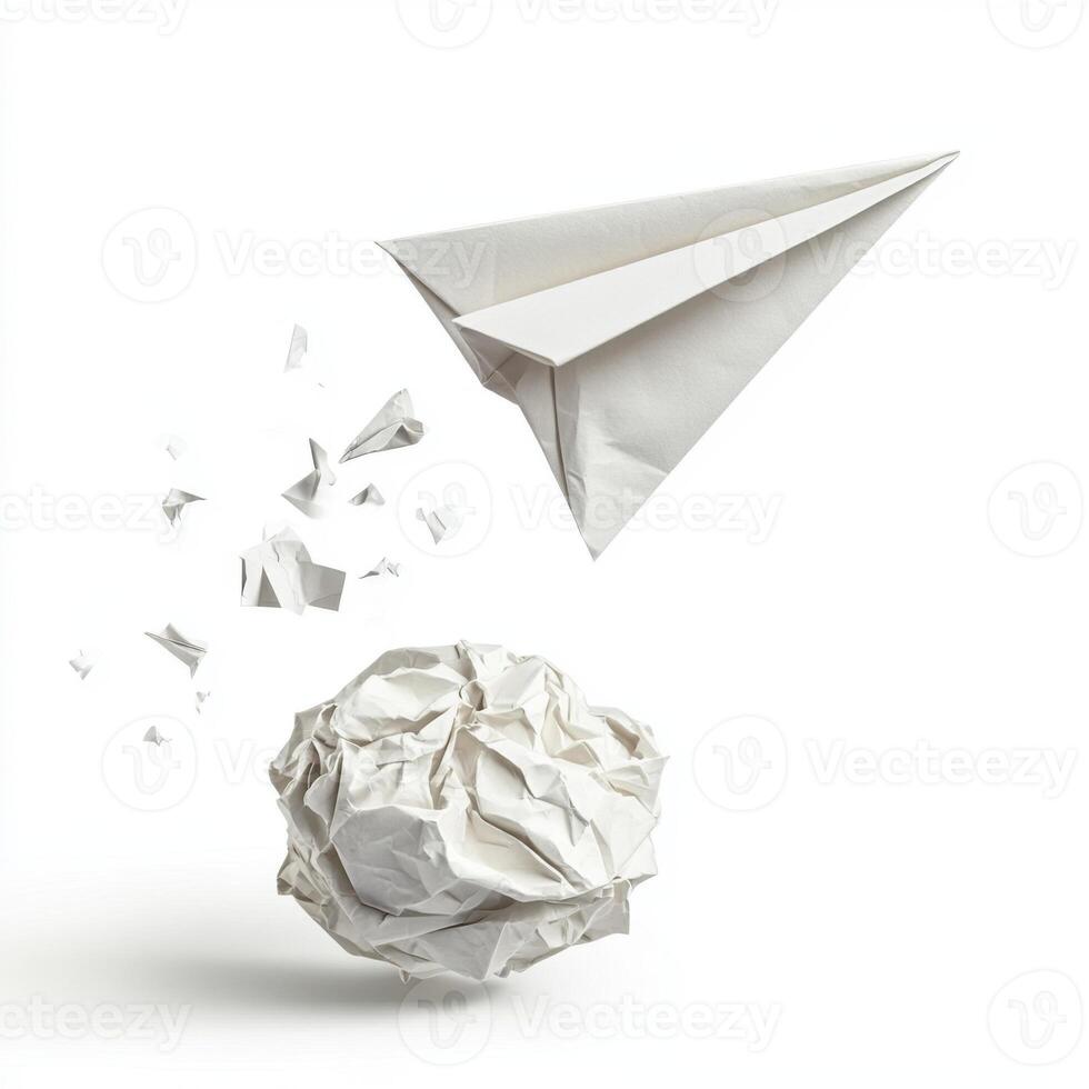 Crumpled paper ball and paper airplane in a playful moment of creativity and imagination photo