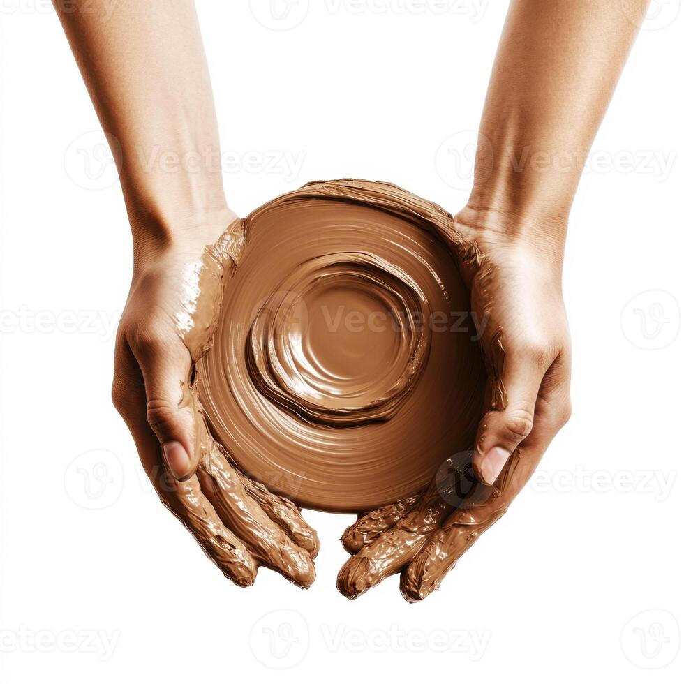 Hands holding a round bowl of smooth clay highlighting craftsmanship and artistic expression photo