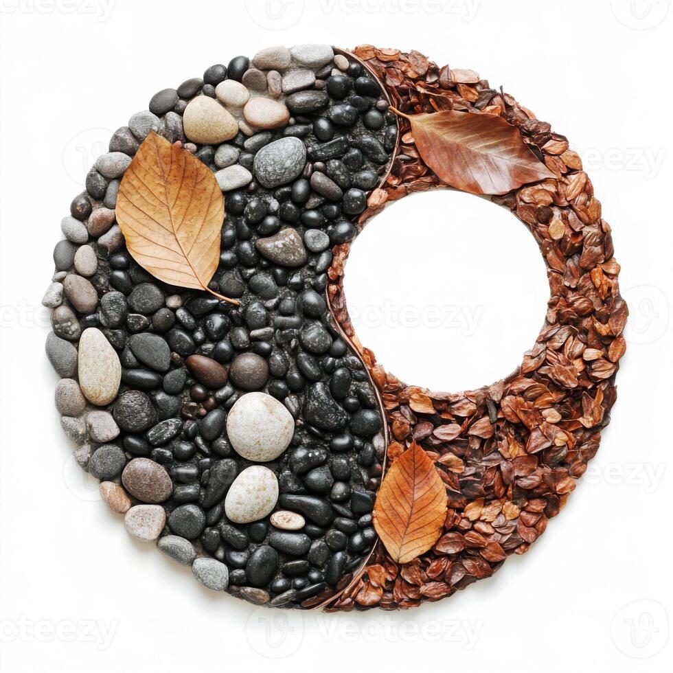 Balanced design featuring stones and dried leaves in yin yang symbol representing harmony and nature photo