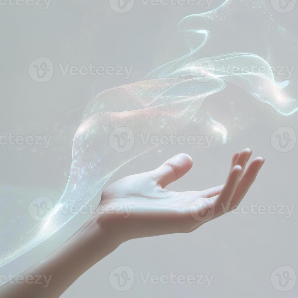 Delicate hand reaching out to ethereal wisps of energy in a calm, light-filled atmosphere photo