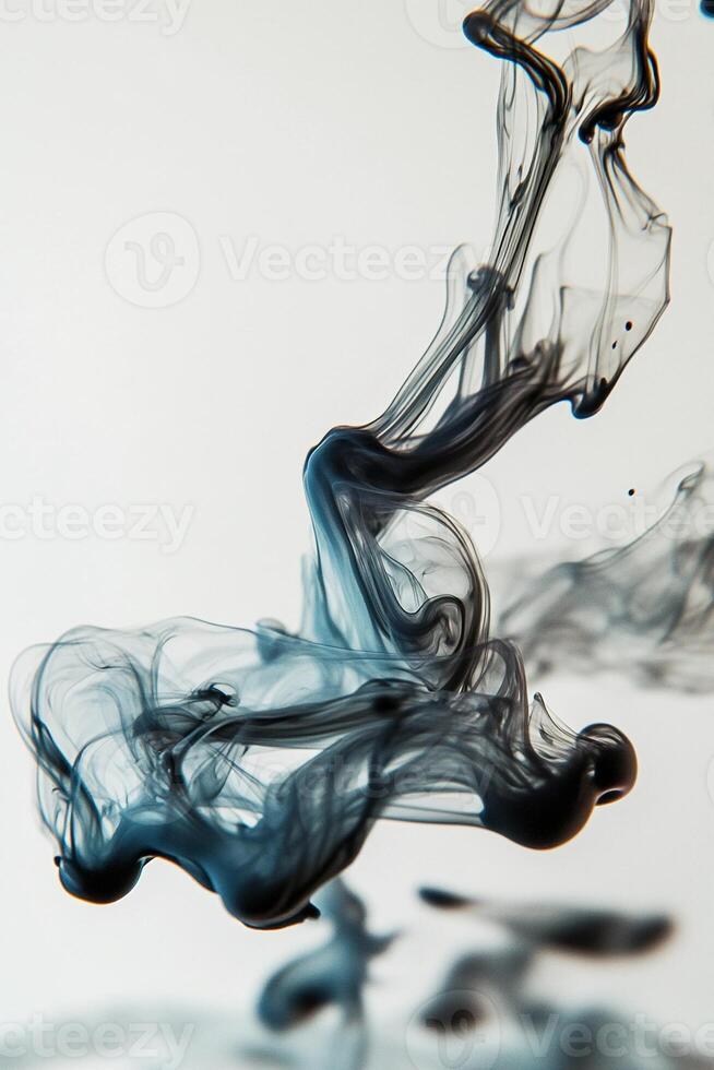 Macro photography of a drop of ink dispersing in water creating fluid shapes and abstract forms with intricate swirls and patterns - Variant 31 photo