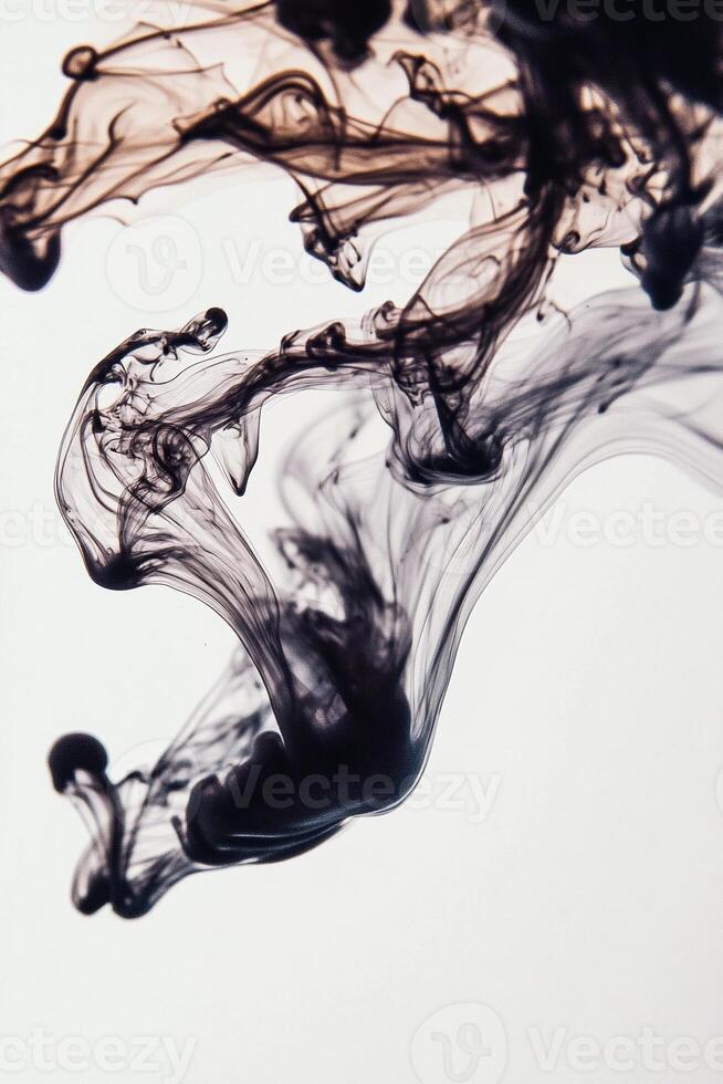 Macro photography of a drop of ink dispersing in water creating fluid shapes and abstract forms with intricate swirls and patterns - Variant 30 photo