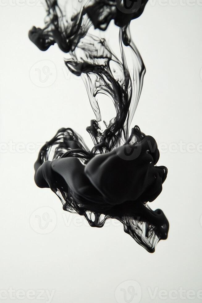 Macro photography of a drop of ink dispersing in water creating fluid shapes and abstract forms with intricate swirls and patterns - Variant 32 photo