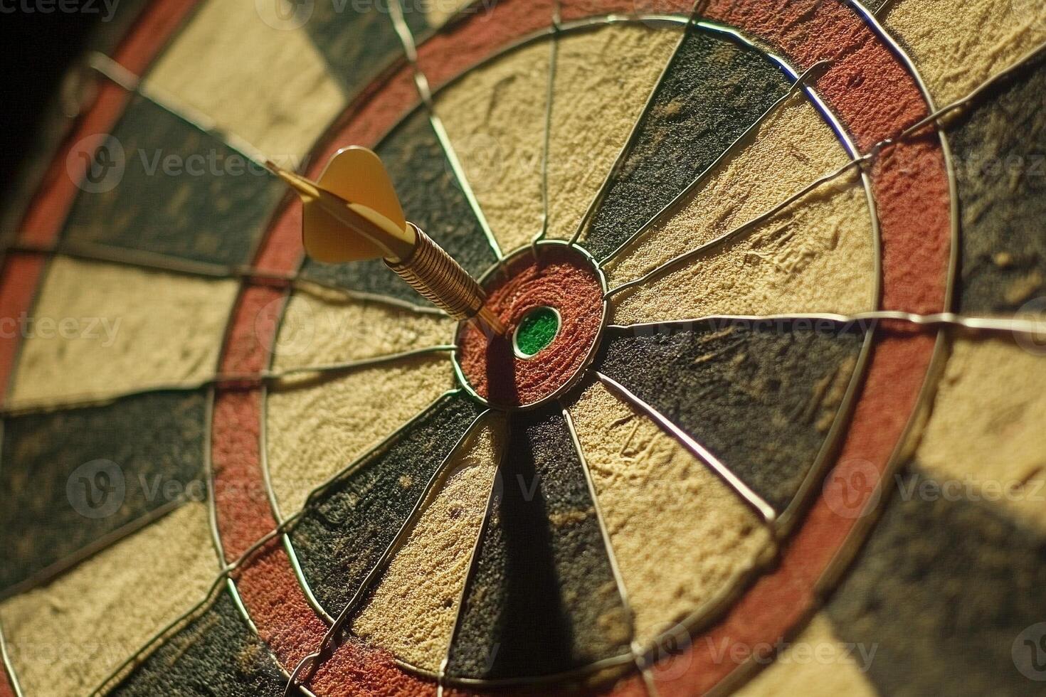 Close up of a dartboard with a single dart hitting the bullseye in dramatic lighting photo