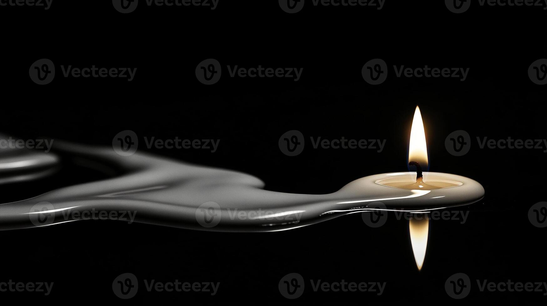 Artistic display of a single white candle melting onto reflective surface in dramatic low light photo