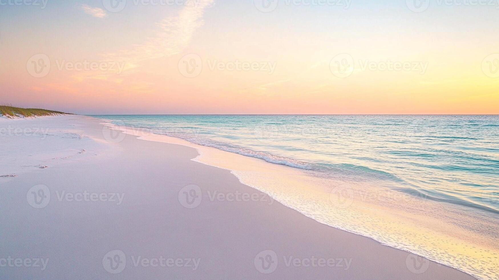Serene stock photo of a tranquil sandy beach with calm ocean waves during vibrant sunrise