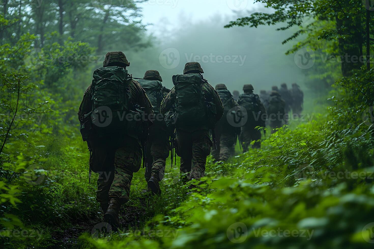 Soldiers Marching Through Dense Forest in Misty Weather - Military Training Concept photo
