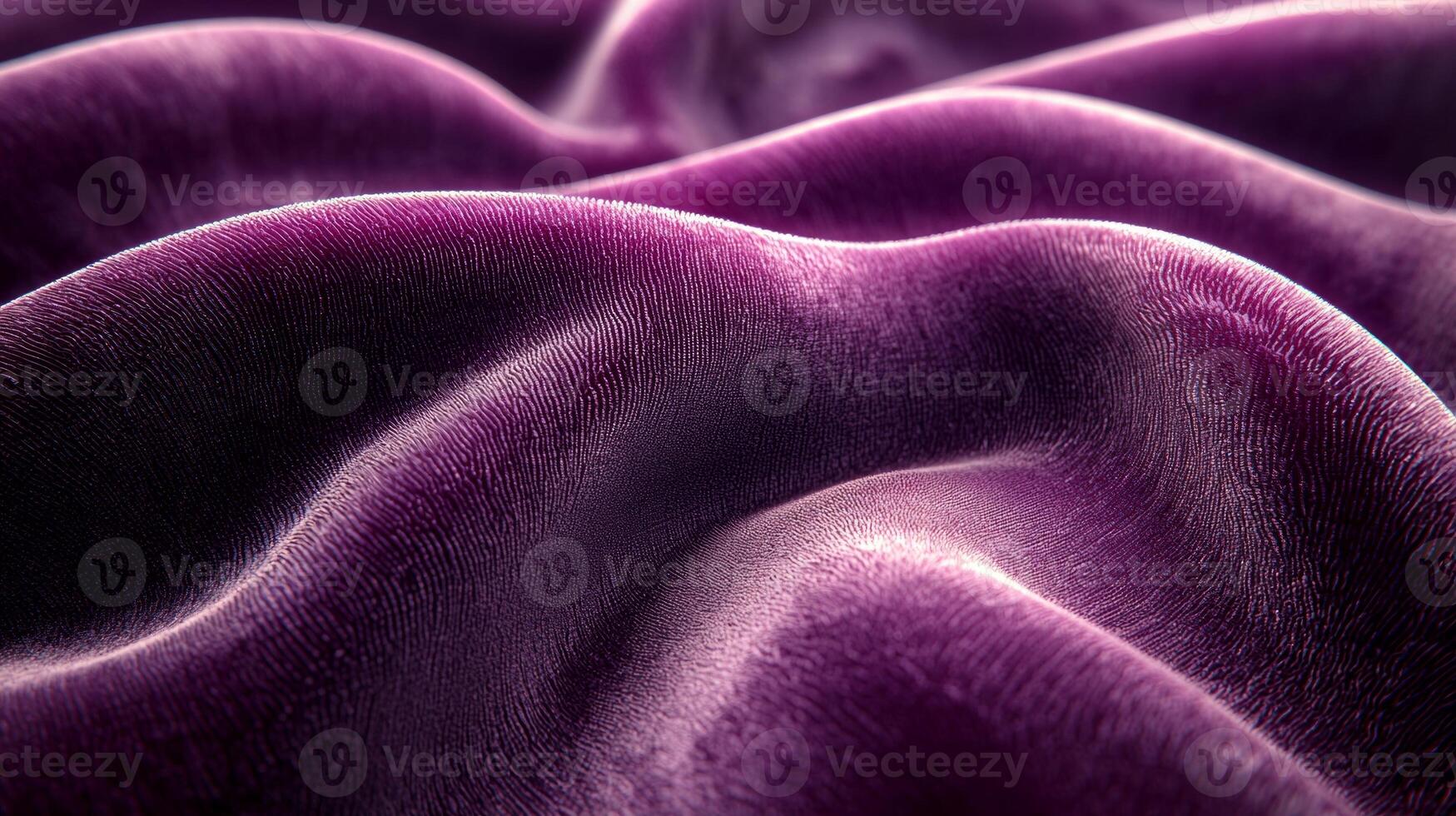 macro view captures plush texture and soft sheen of burgundy velvet fabric. lighting creates gentle highlights and shadows enhancing luxurious appearance and depth of material photo