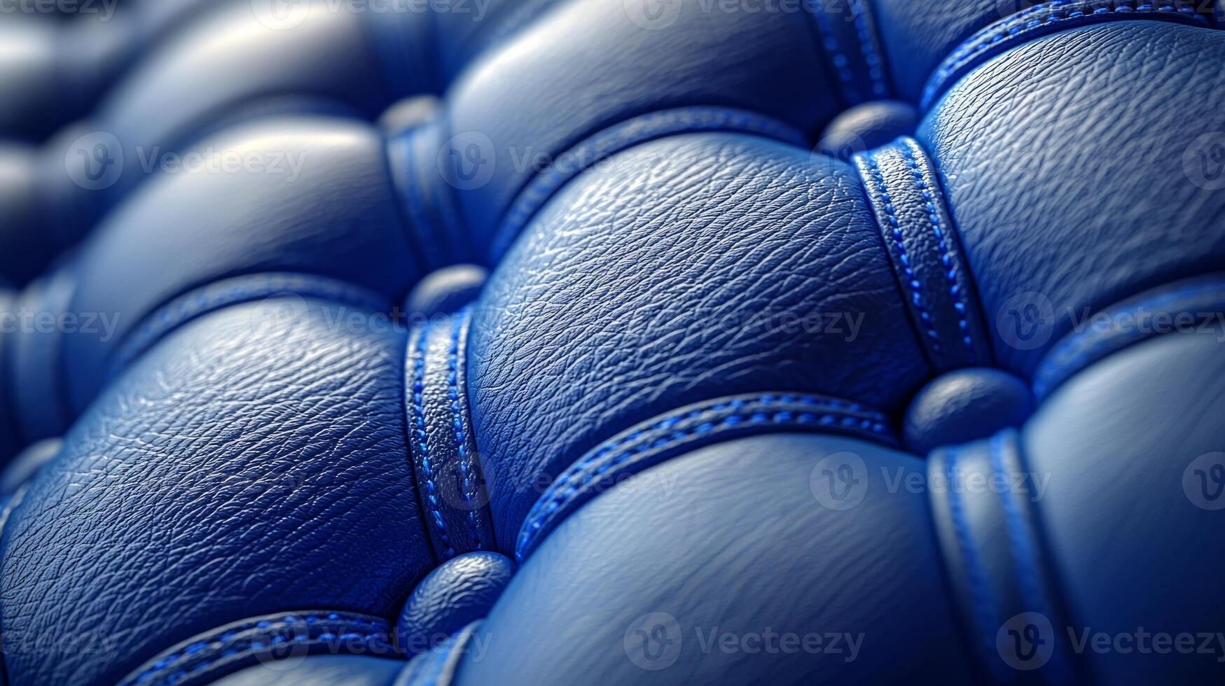 Quilted fabric demonstrates rich padded texture diamond stitch pattern highlighted soft sheen and vibrant blue color creating modern and inviting atmosphere photo