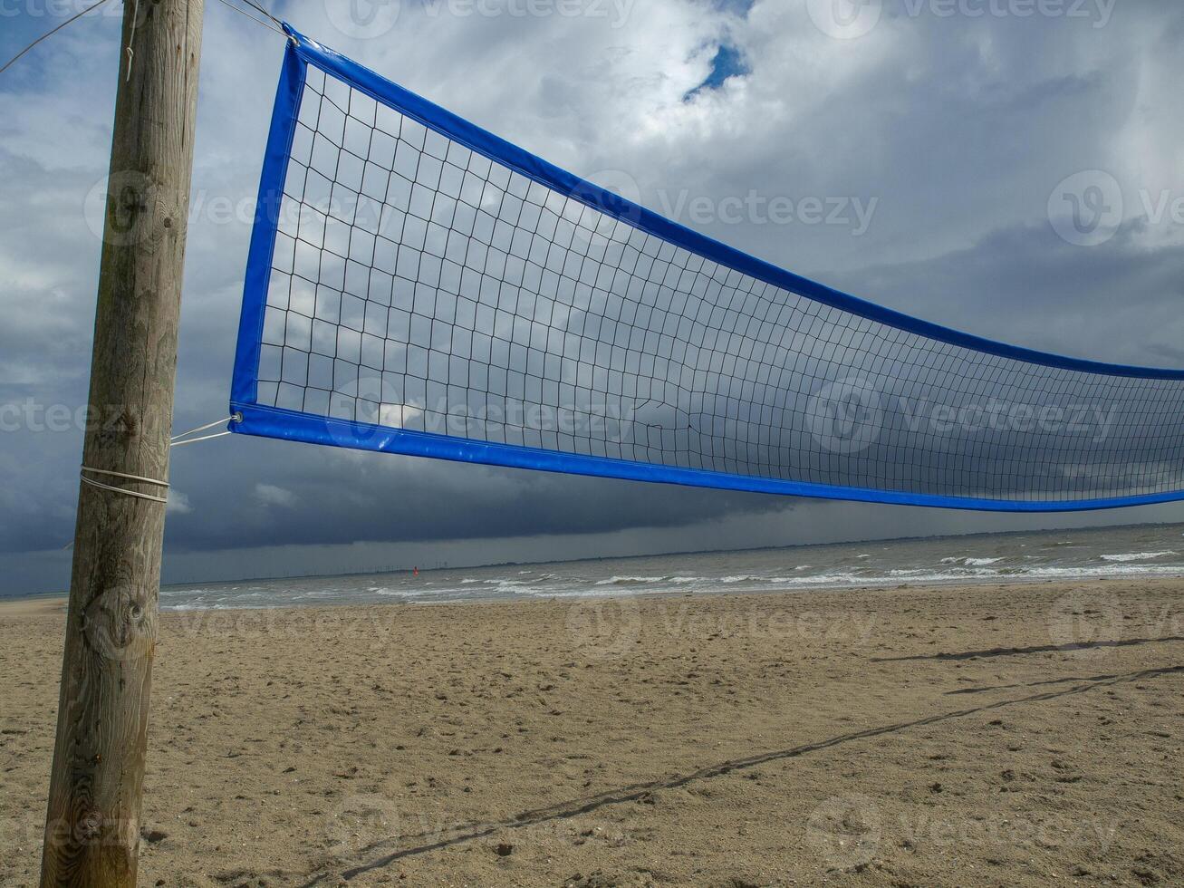 A volleyball net on the beach of norderney germany photo