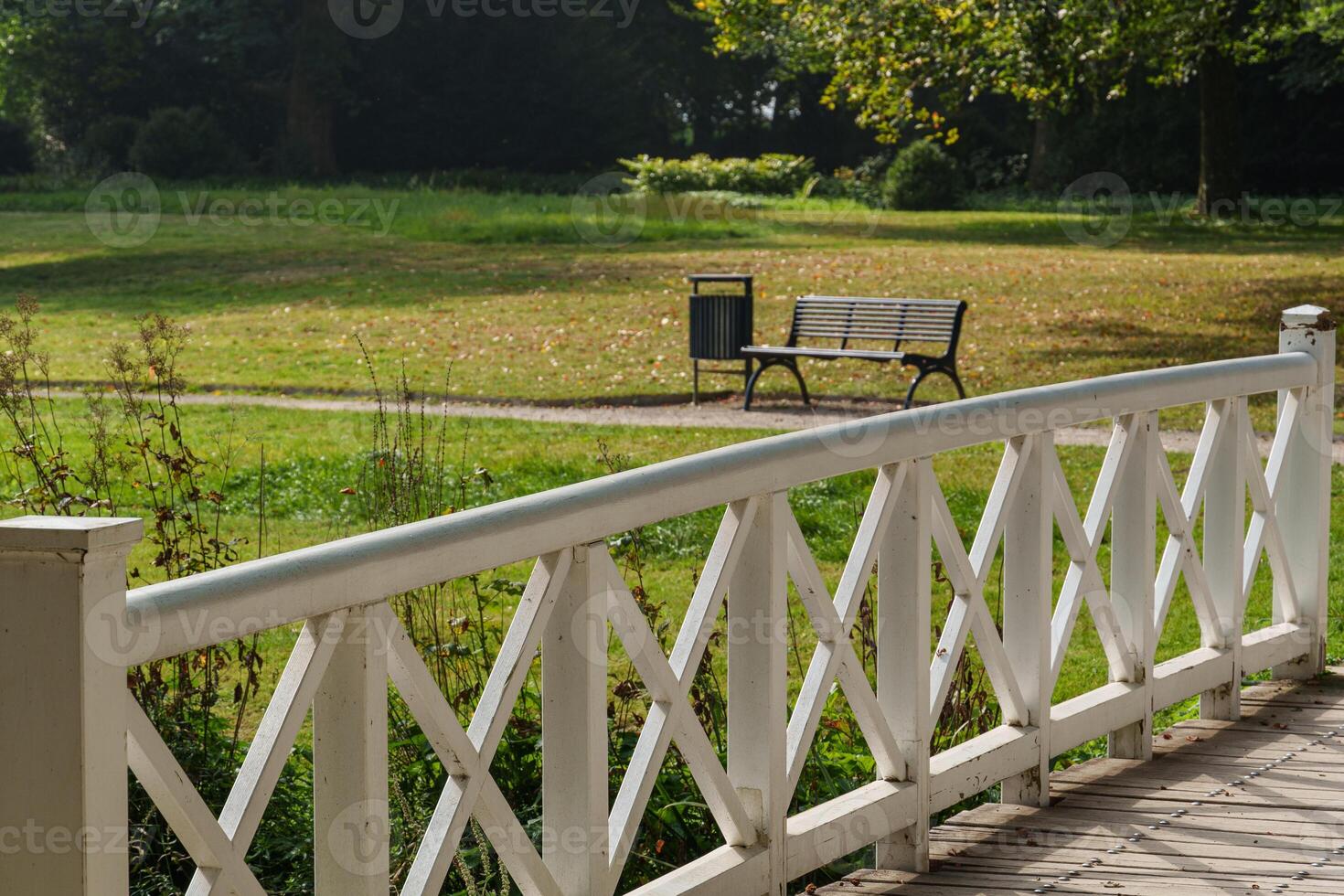 A white fence in a park photo