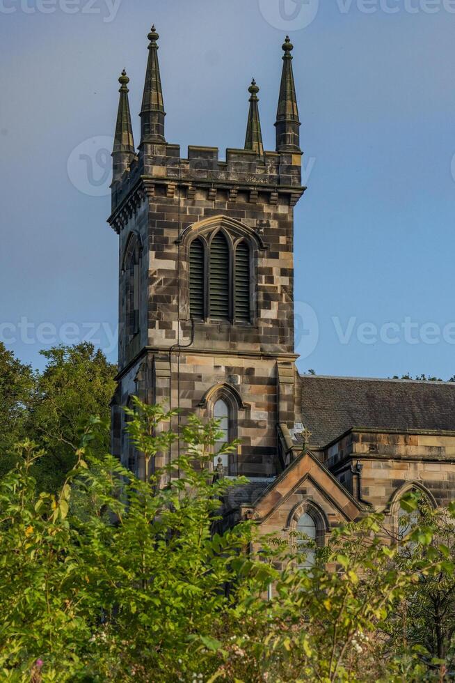 A large stone church with a tower photo